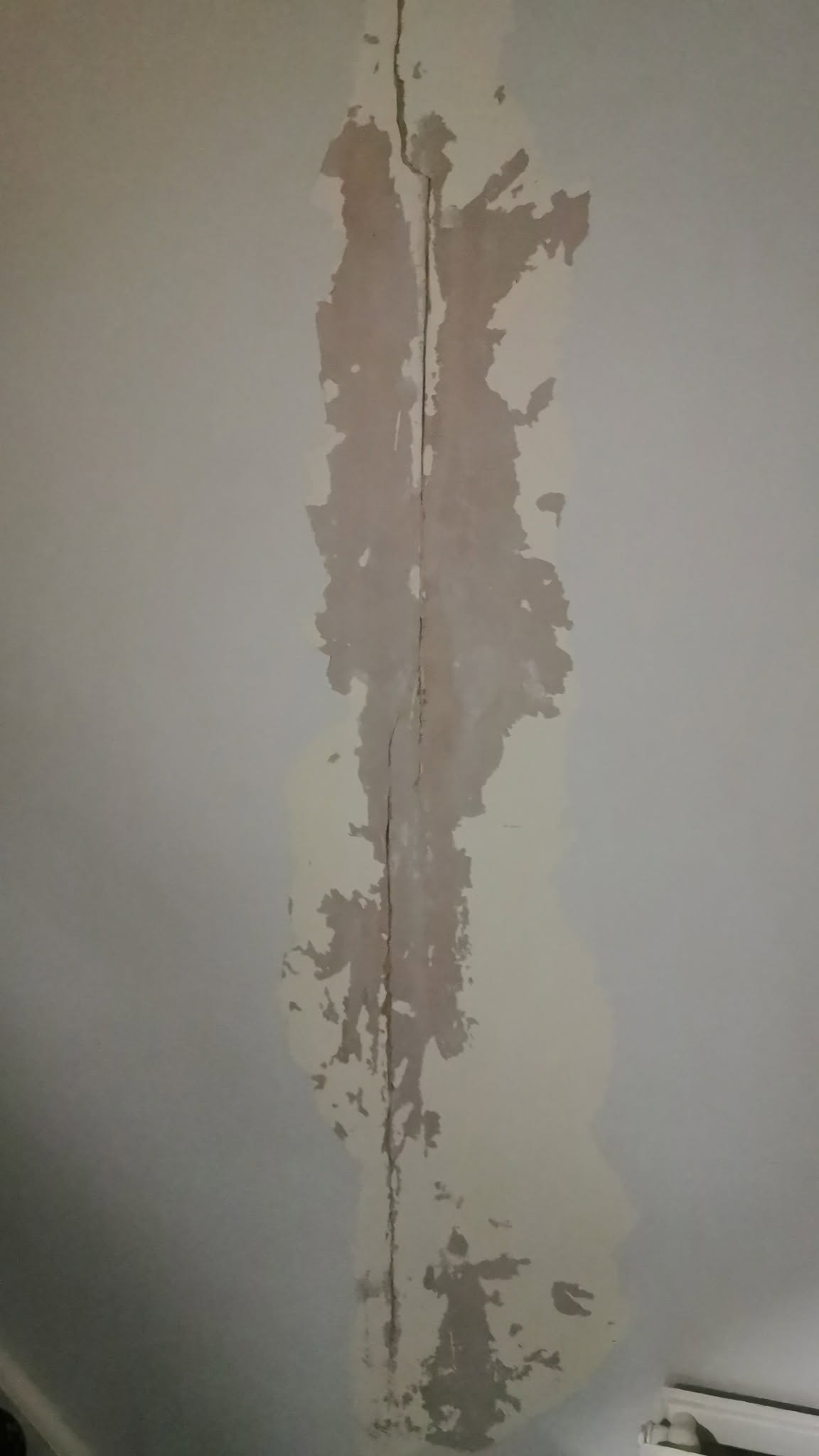 Wall surface before crack repair by Essex Decorating Solutions in Basildon, Essex